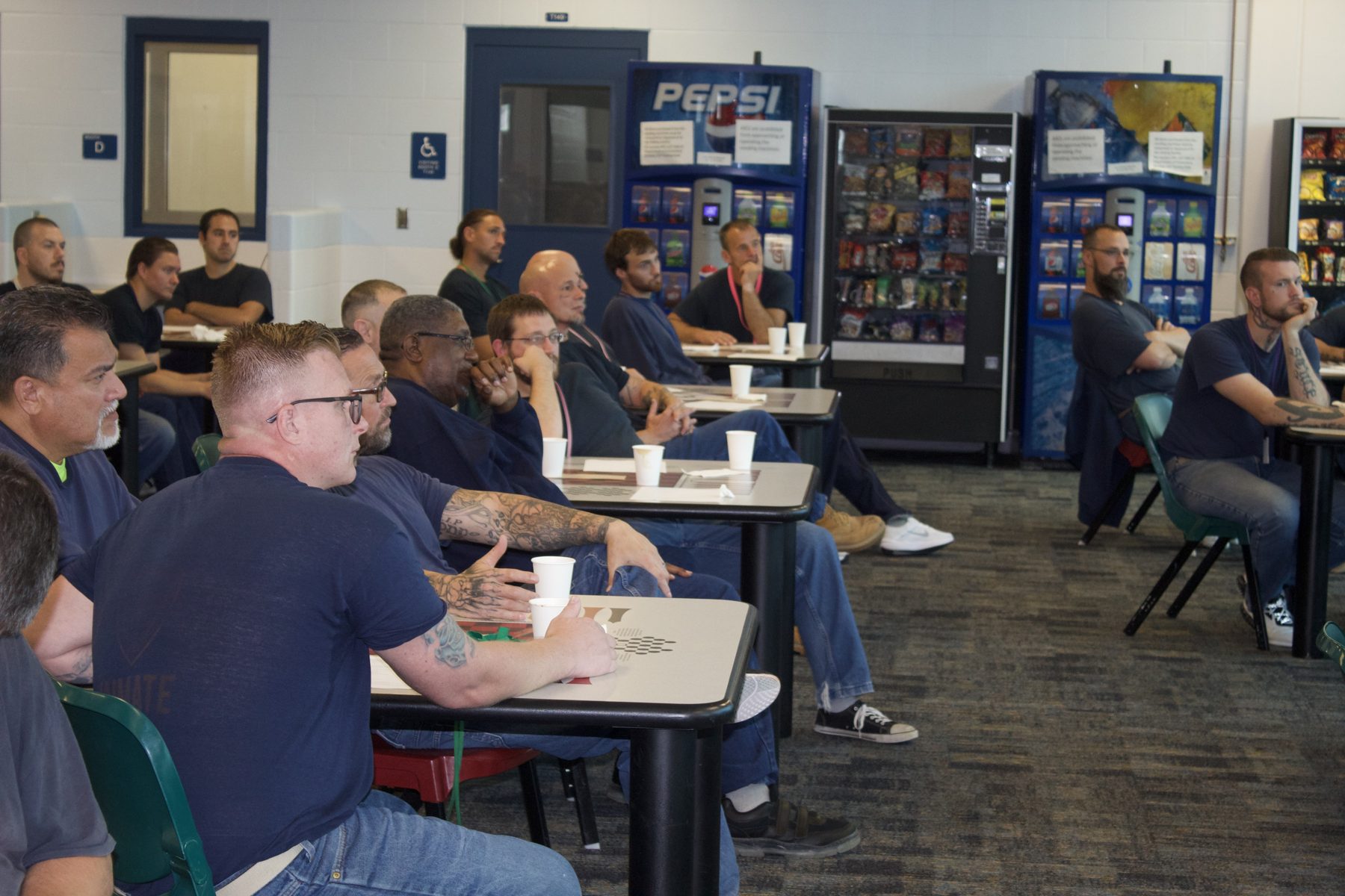 Participants seated and engaged during an I3 classroom session